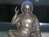 British Museum Top 20 Buddhism 18 Milarepa 18. Milarepa � Tibet, 18C AD or earlier, 12.8cm high. Milarepa ('the cotton clad', 1052-1135) is one of the most loved saints of Tibet. He is especially remembered for the huge number of songs he composed. He is considered a founder of the Kargyupa order of Tibetan Buddhism, though he himself was a disciple of Marpa. In this bronze image he is recognized by the right hand held up to his ear, indicating that he is reciting one of his celebrated poems or songs.